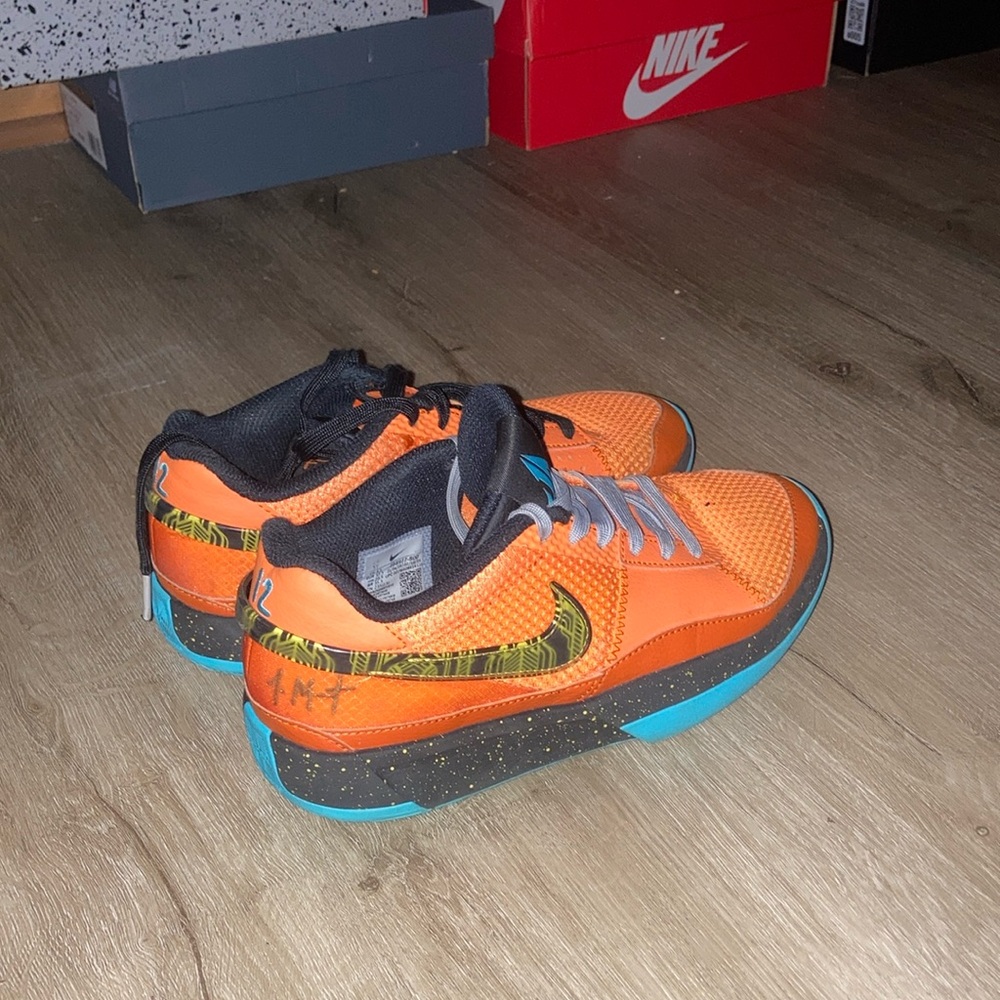Nike Orange Sneakers with Iconic Swoosh and Low-Top Design